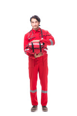 Young paramedic in red uniform isolated on white 