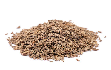 Pile of cumin seeds isolated on white background