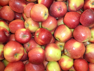 fresh ripe red apples piled in a pile