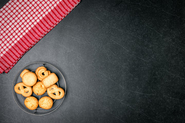 Cookies on Black stone table background.