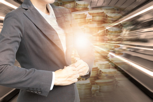 Double exposure of business woman with stack coins at airport background.