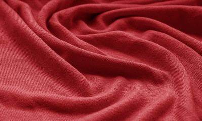 The texture of a knitted woolen fabric red.