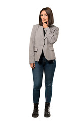 A full-length shot of a Young business woman thinking over isolated white background