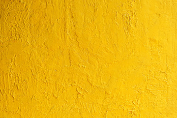 Abstract background from golden wall texture with sunlight. Luxury and elegant wallpaper.