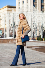 Young beautiful woman in winter coat