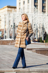 Young beautiful woman in winter coat