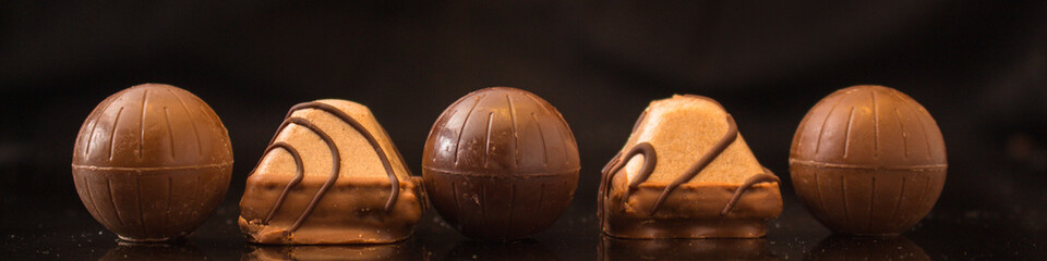 candies chocolate filled (cream filling). food background. top view