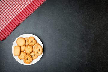 Cookies on Plate with Black stone table background.