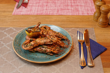 Shrimps fried with herbs and garlic