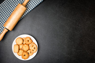 Cookies on Plate with Black stone table background.