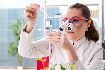 Female biotechnology scientist chemist working in the lab 