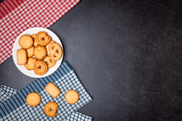 Cookies on Plate with Black stone table background.