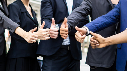 Team business partners giving Thumb up show unity ,Successful teamwork partnership , business concept
