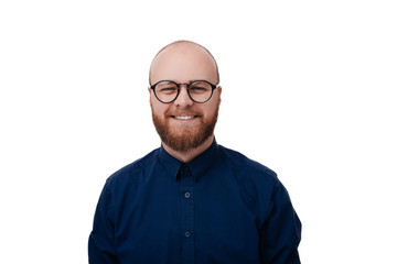 Portrait of happy bearded man wearing spectacles and looking at camera. Man with beard and glasses feeling confident.