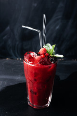 Berry smoothie on rustic background - Healthy eating, Detox or Diet concept