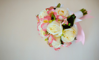 bridal beautiful bouquet made of different flowers on grey background. colorful color mix flower. close-up