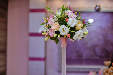 bridal beautiful bouquet made of different flowers on grey background. colorful color mix flower. close-up