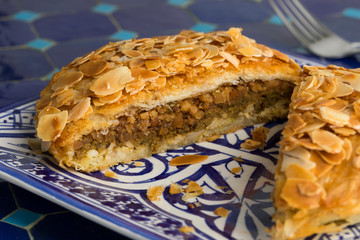 Dish with sliced traditional Moroccan small bastella