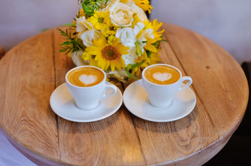 Wedding bouquet with a cup of coffee
