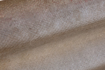 Gray background of old roof cover on private house.
