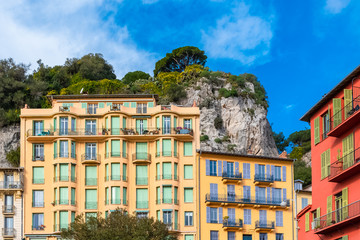 Naklejka premium Nice, France, beautiful houses built on hillside, on the marina, with typical windows and shutters 