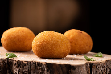 Arancini - italian rice balls which are coated with bread crumbs and then deep fried