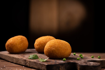 Arancini - italian rice balls which are coated with bread crumbs and then deep fried