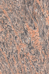 Pink orange black Indian flat granite texture background