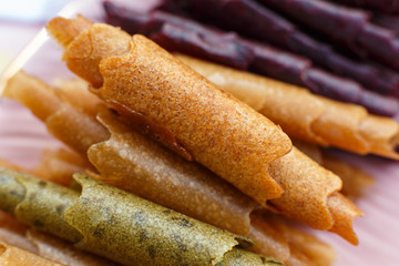 Closeup set of colorful pastillum rolls on tray