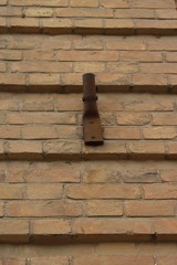  Old flagpole on the wall of an old brick building