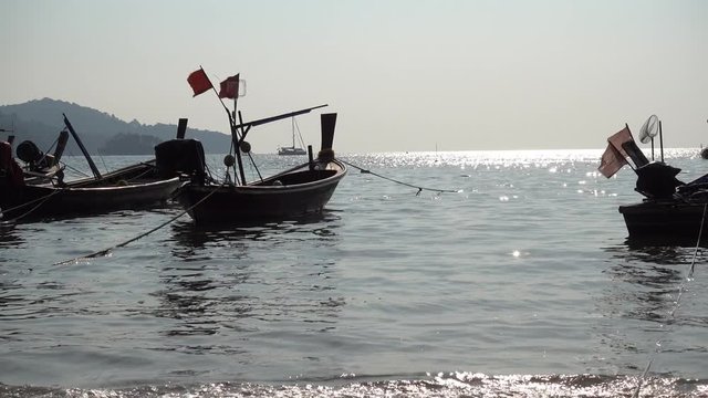 Longtail boats parking near by beach on Phuket