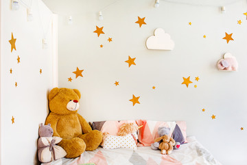 Child dream concept. Cosy bedroom decorated with toys and stars