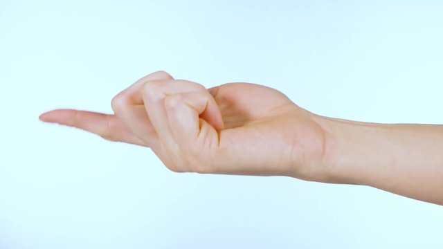 Female hand gestures to come and exits frame