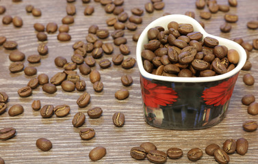 Coffee cup and many coffee beans