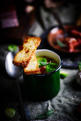 Brussels sprouts soup with bacon.dark photo