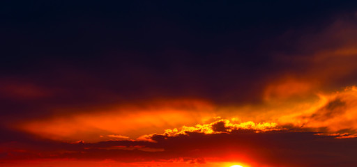 Beautiful sunset with dramatic clouds on the sky