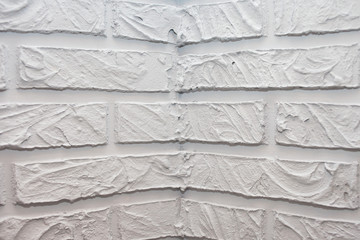 Decorative bricks made of gypsum plaster. Painted in grey.