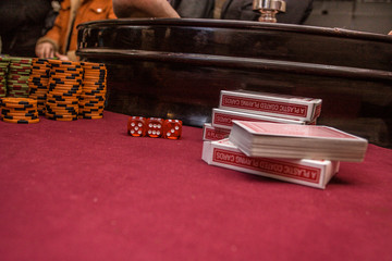 roulette accessories on red gaming table