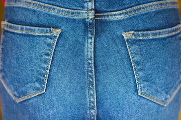 Fototapeta premium Female ass in jeans closeup