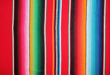 cinco de mayo Mexican blanket Mexico poncho serape fiesta traditional poncho background Mexican stripes copy space blanket minimal simple cinco de mayo serape pattern background  -  stock photo