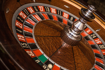 roulette accessories on red gaming table