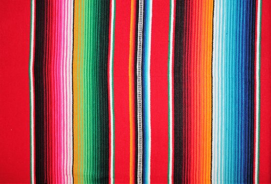cinco de mayo Mexican blanket Mexico poncho serape fiesta traditional poncho background Mexican stripes copy space blanket minimal simple cinco de mayo serape pattern background  -  stock photo