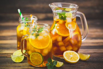 Ice tea with lemon, lime and mint 
