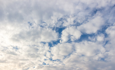 White fluffy clouds and blue sky