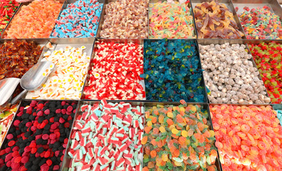 candies shop with colorful varieties of sweetened candy for sale