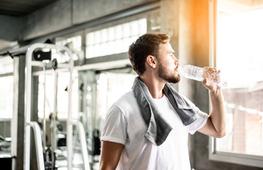 Young sport man athlete with handkerchief relax after break workout