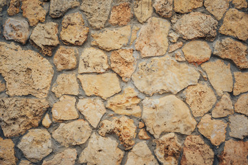 masonry made of rough stone material, can be used as background or texture for your ideas.