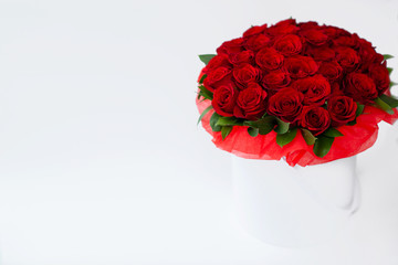 bouquet of red rosesbouquet of red roses in a white box on a white background isolated