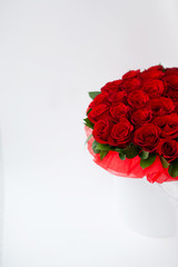 bouquet of red rosesbouquet of red roses in a white box on a white background isolated