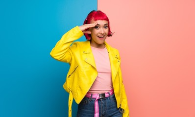 Young woman with yellow jacket has just realized something and has intending the solution